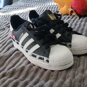 Adidas Superstar Black and White with Gold Accents